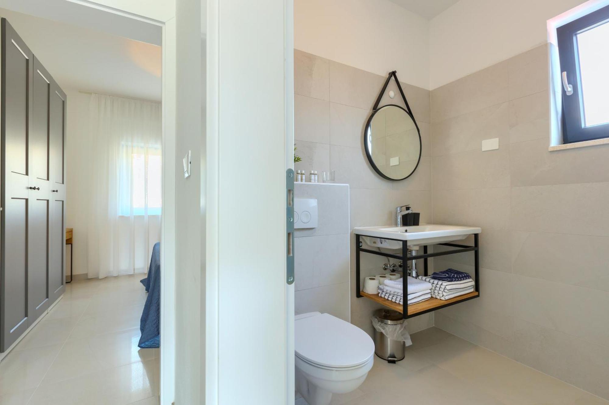 Apartments La Scogliera 로비니 객실 사진